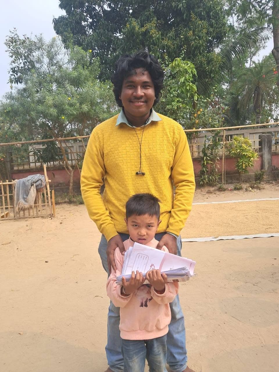 Happy volunteer & a student
